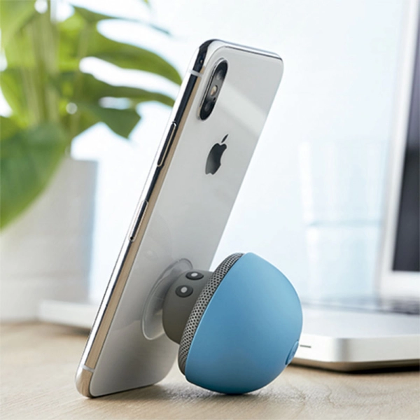 Parlante Bluetooth Bros, en silicona, con soporte para móviles, 6.8 x 5.5 cmts